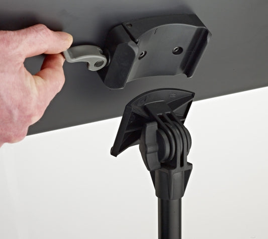 Hand adjusting a black adjustable stand on a white background