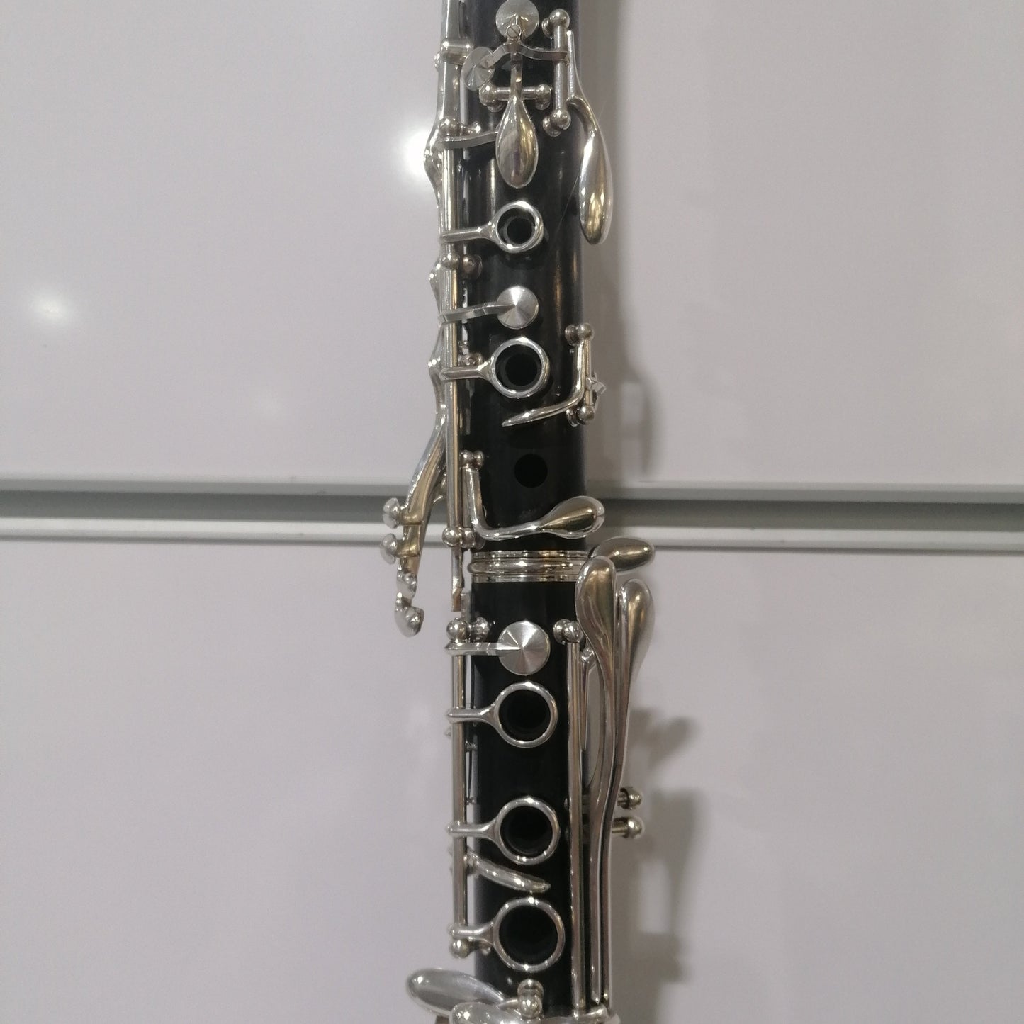 Close-up of a clarinet on a white background