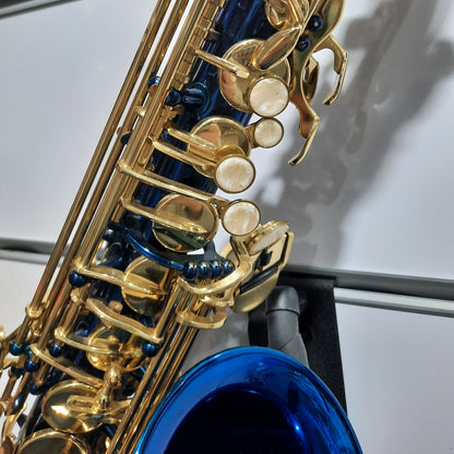 Close-up of a gold and blue saxophone on a stand