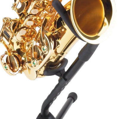 Gold saxophone on a black stand against a white background